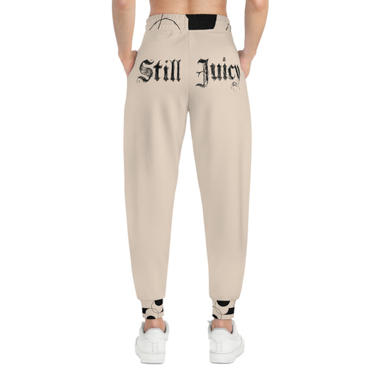 Still Juicy Athletic Joggers — Graphic Brown Joggers with 'Still Juicy' Back Text & North Star Raccoon Accent